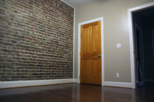 Exposed brick and hard wood floors in our downtown lofts
